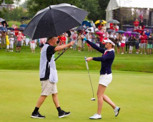 Julie Greciet of France celebrates her maiden victory on the Ladies European Tour with her father who was caddying for her