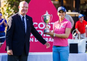 Azahara Munoz of Spain is presented with her trophy by the Jean Lou Charon, President of the French GOlf Federation