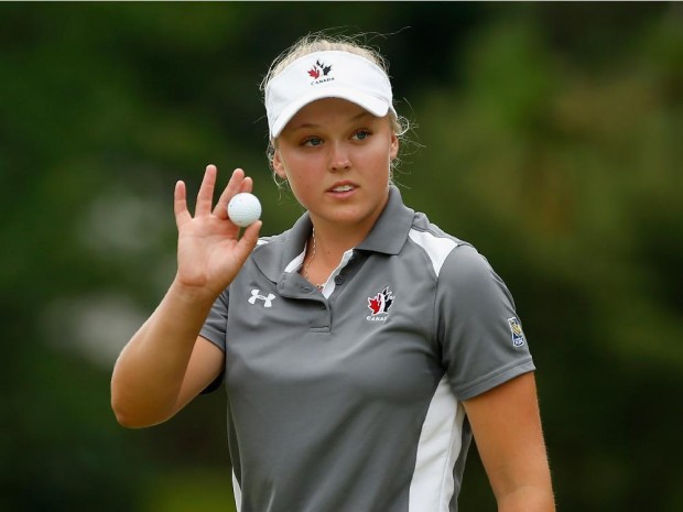 PINEHURST, NC - JUNE 21:  Amateur Brooke Henderson of Canada waves to the gallery on the first hole during the third round of the 69th U.S. Women's Open at Pinehurst Resort & Country Club, Course No. 2 on June 21, 2014 in Pinehurst, North Carolina.  (Photo by Scott Halleran/Getty Images)