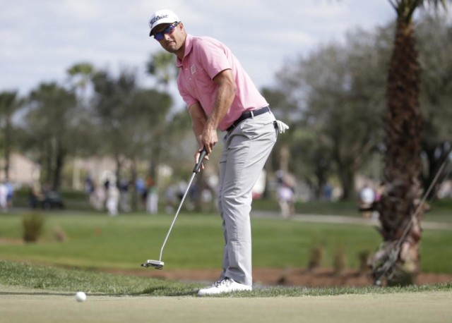 Adam Scott, of Australia, watches his putt on the third green during the fourth round of the Honda Classic golf tournament, Sunday, Feb. 28, 2016, in Palm Beach Gardens, Fla. (AP Photo/Lynne Sladky)