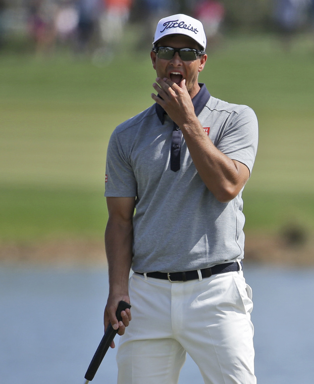 Adam Scott, of Australia, reacts after missing a birdie putt on the first hole during the third round of the Honda Classic golf tournament, Saturday, Feb. 27, 2016, in Palm Beach Gardens, Fla. (AP Photo/Lynne Sladky)
