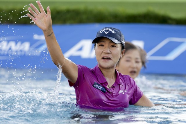 Lydia Ko, of New Zealand, waves after winning the LPGA Tour ANA Inspiration golf tournament at Mission Hills Country Club, Sunday, April 3, 2016, in Rancho Mirage, Calif. (AP Photo/Gregory Bull)