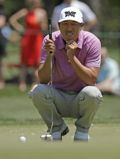 James Hahn lines up a putt on the first hole during the final round of the Wells Fargo Championship golf tournament at Quail Hollow Club in Charlotte, N.C., Sunday, May 8, 2016. (AP Photo/Chuck Burton)