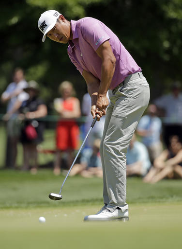 James Hahn putts on the first hole during the final round of the Wells Fargo Championship golf tournament at Quail Hollow Club in Charlotte, N.C., Sunday, May 8, 2016. (AP Photo/Chuck Burton)