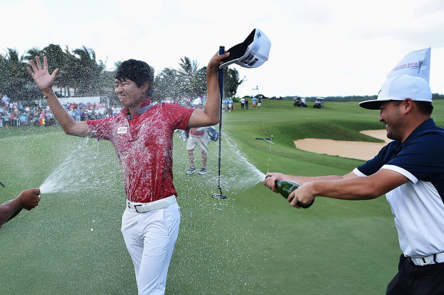 POSTE DE FLACQ, MAURITIUS - MAY 15: Jeunghun Wang of Korea is sprayed with champagne after winning the AfrAsia Bank Mauritius Open at Four Seasons Golf Club Mauritius at Anahita on May 15, 2016 in Poste de Flacq, Mauritius. (Photo by Stuart Franklin/Getty Images)