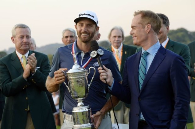 Jun 19, 2016; Oakmont, PA, USA; Dustin Johnson holds the championship trophy while interviewed by FOX announcer Joe Buck after winning the U.S. Open golf tournament at Oakmont Country Club. Mandatory Credit: Michael Madrid-USA TODAY Sports
