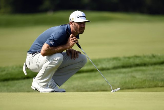 Jun 19, 2016; Oakmont, PA, USA; Dustin Johnson lines up a putt on the 7th green during the final round of the U.S. Open golf tournament at Oakmont Country Club. Mandatory Credit: John David Mercer-USA TODAY Sports