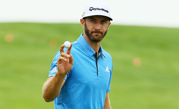 OAKMONT, PA - JUNE 17: Dustin Johnson of the United States waves to the gallery on the first green during the continuation of the weather delayed first round of the U.S. Open at Oakmont Country Club on June 17, 2016 in Oakmont, Pennsylvania. (Photo by Andrew Redington/Getty Images)
