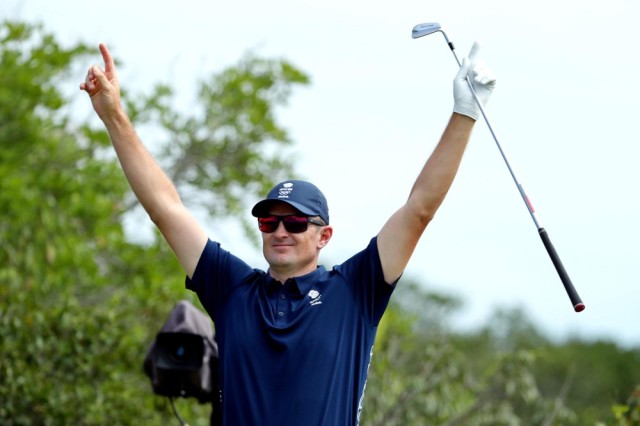 Aug 11, 2016; Rio de Janeiro, Brazil; Justin Rose (GBR) celebrates getting a hole in one on the 4th hole during round 1 of the men's golf in the Rio 2016 Summer Olympic Games at Olympic Golf Course. Mandatory Credit: Jason Getz-USA TODAY Sports ORG XMIT: USATSI-319352 ORIG FILE ID: 20160811_pjc_gb1_405.JPG